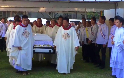 Diocesan priests of Marbel carry the coffin of Bishop Emeritus Dinulado Gutierrez to his final resting place at the back of Christ the King Cathedral in Koronadal City on Wednesday (Feb. 20). (Photo courtesy of Faye Mempin – Diocese of Marbel office) 