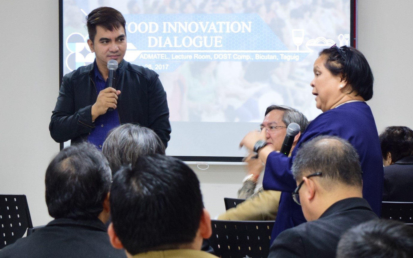 Dr. Carl E. Balita moderates the discussion as Dr. Azanza explains how better packaging and labeling can prolong the shelf-life of products.