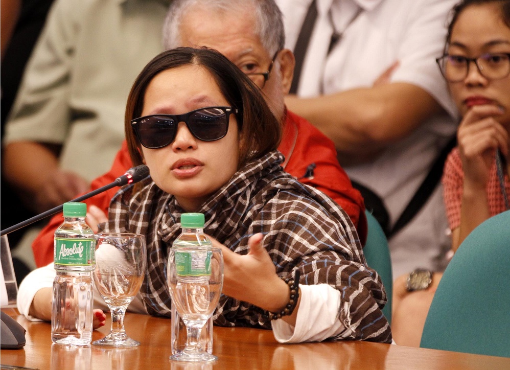 Witness Harra Kazuo during the public hearing on dangerous drugs and alleged extrajudicial killings on Monday (Aug. 22, 2016) at the Senate session hall in Pasay City. The witness said her live in partner, Jaypee, and his father, Renato Bertes, were shot dead while under police custody last month​. Also in photo is Senate Majority Leader Vicente C. Sotto III. (PNA photos by Jess M. Escaros Jr.)