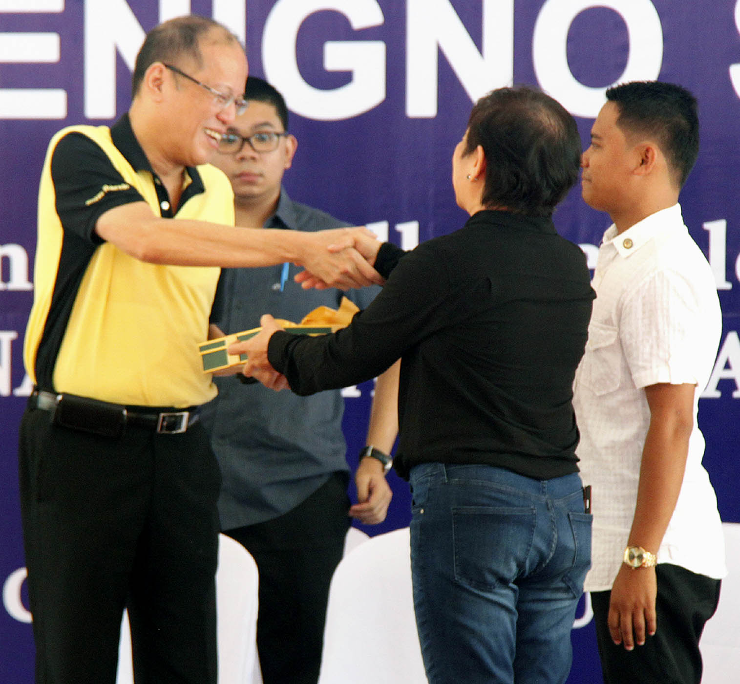 President Benigno S. Aquino III (left) receives a copy of the "Ulat ng TESDA Kina Juan at Juana" from Technical Education and Skills Development Authority (TESDA) Director General Irene Isaac at the TESDA Complex in Taguig City on Tuesday (June 14, 2016). (PNA photo by Joey O. Razon) 